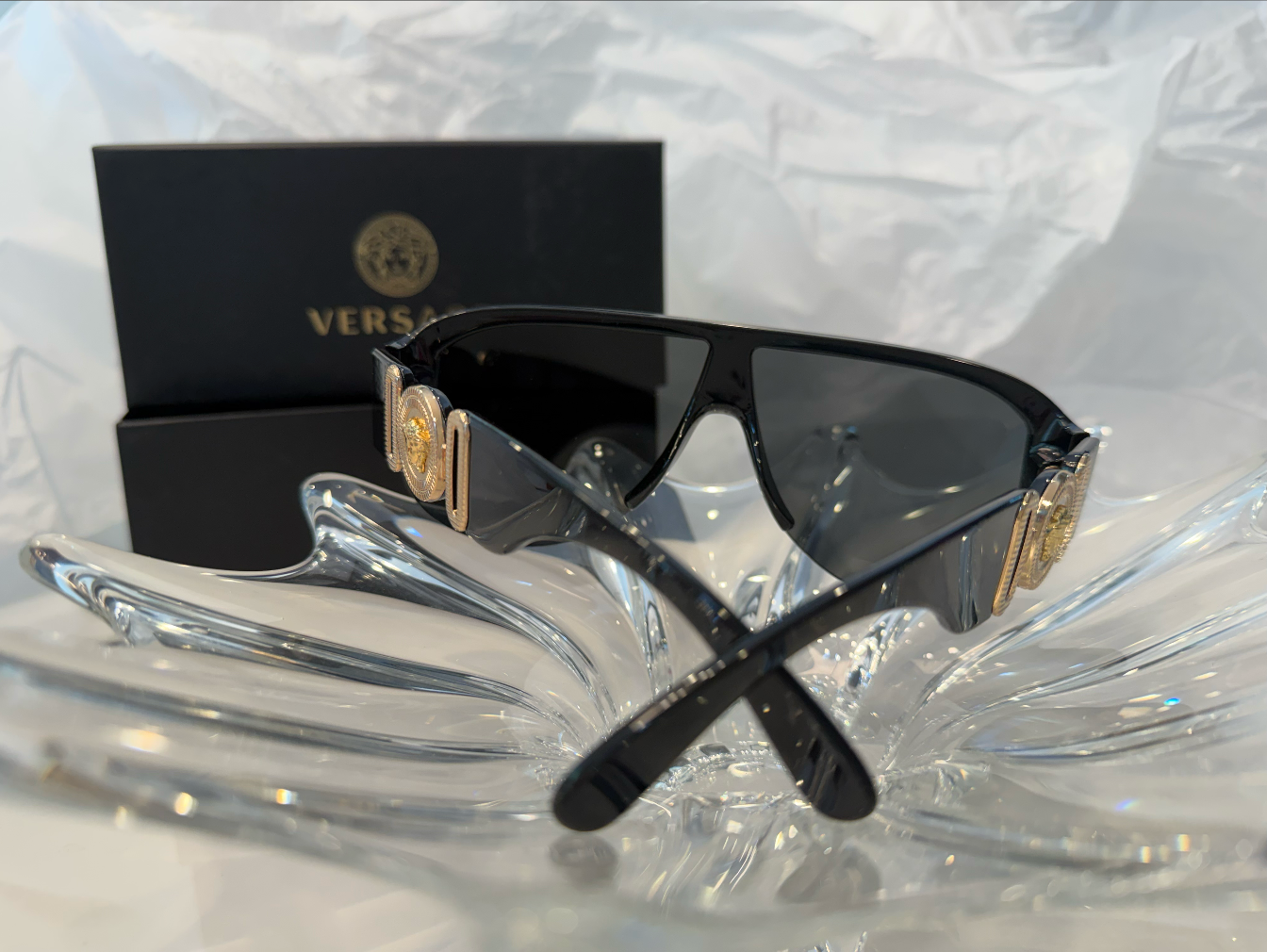Versace VE4381 shield sunglasses front lens view on crystal display