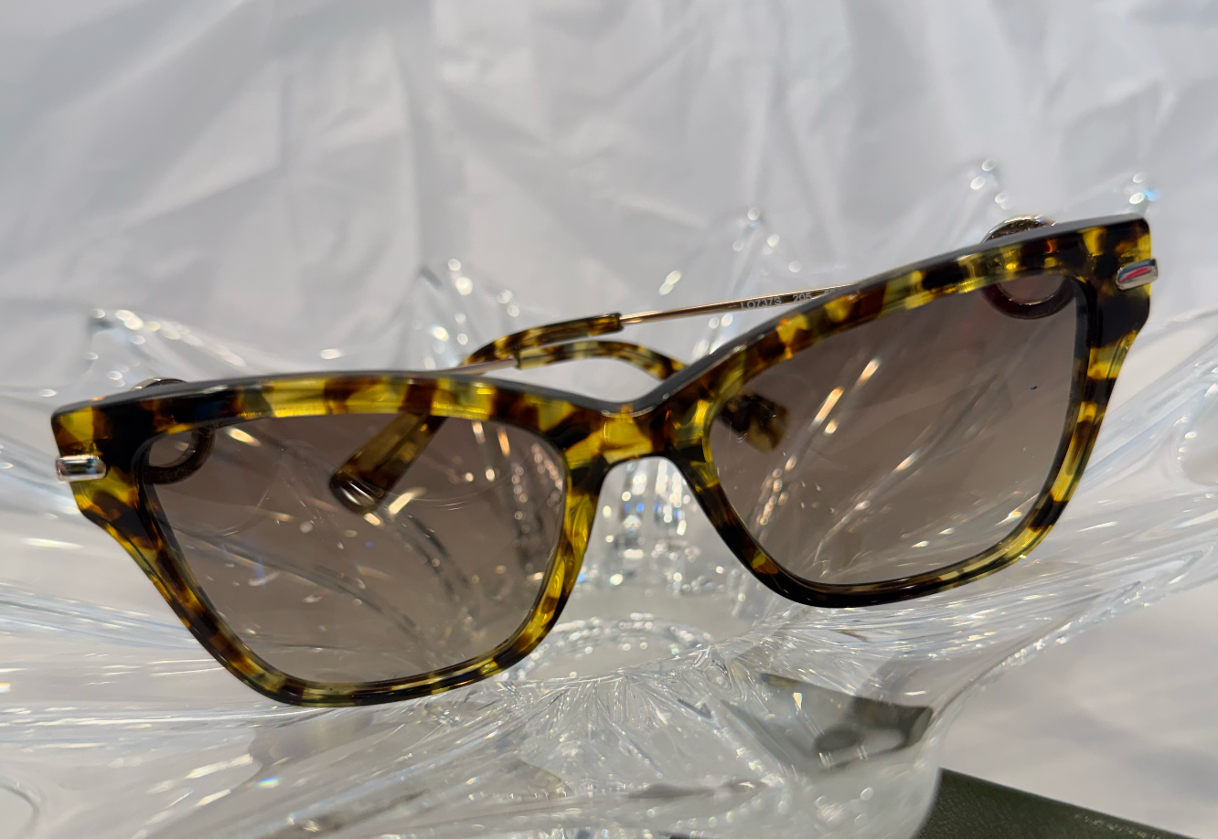 Longchamp LO737S Havana cat eye sunglasses front three-quarter view on crystal display