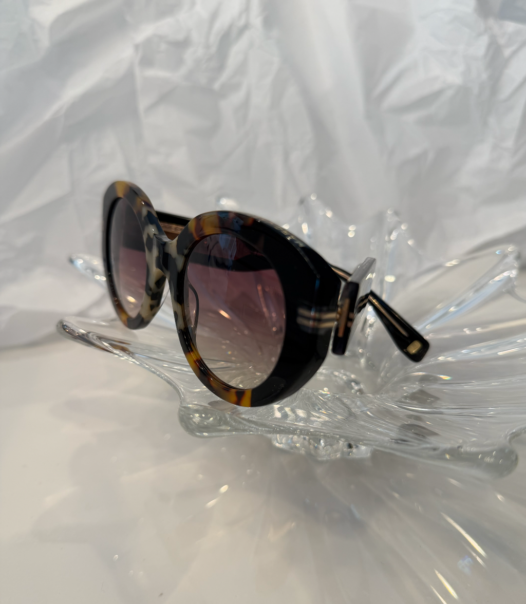 Marc Jacobs MJ1110/S tortoise shell and black sunglasses side profile on crystal display