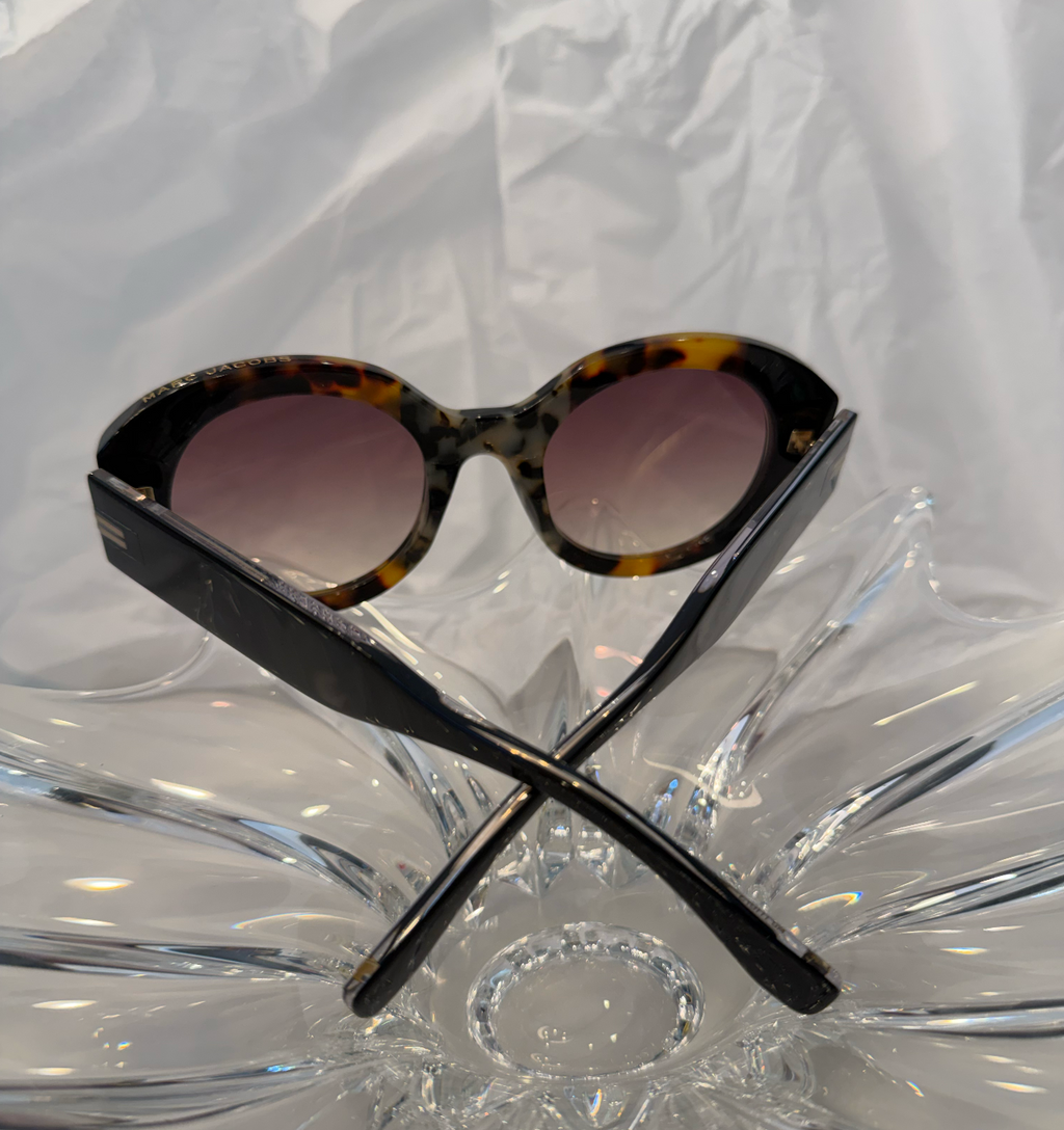 Marc Jacobs MJ1110/S tortoise shell oval sunglasses front view on crystal display