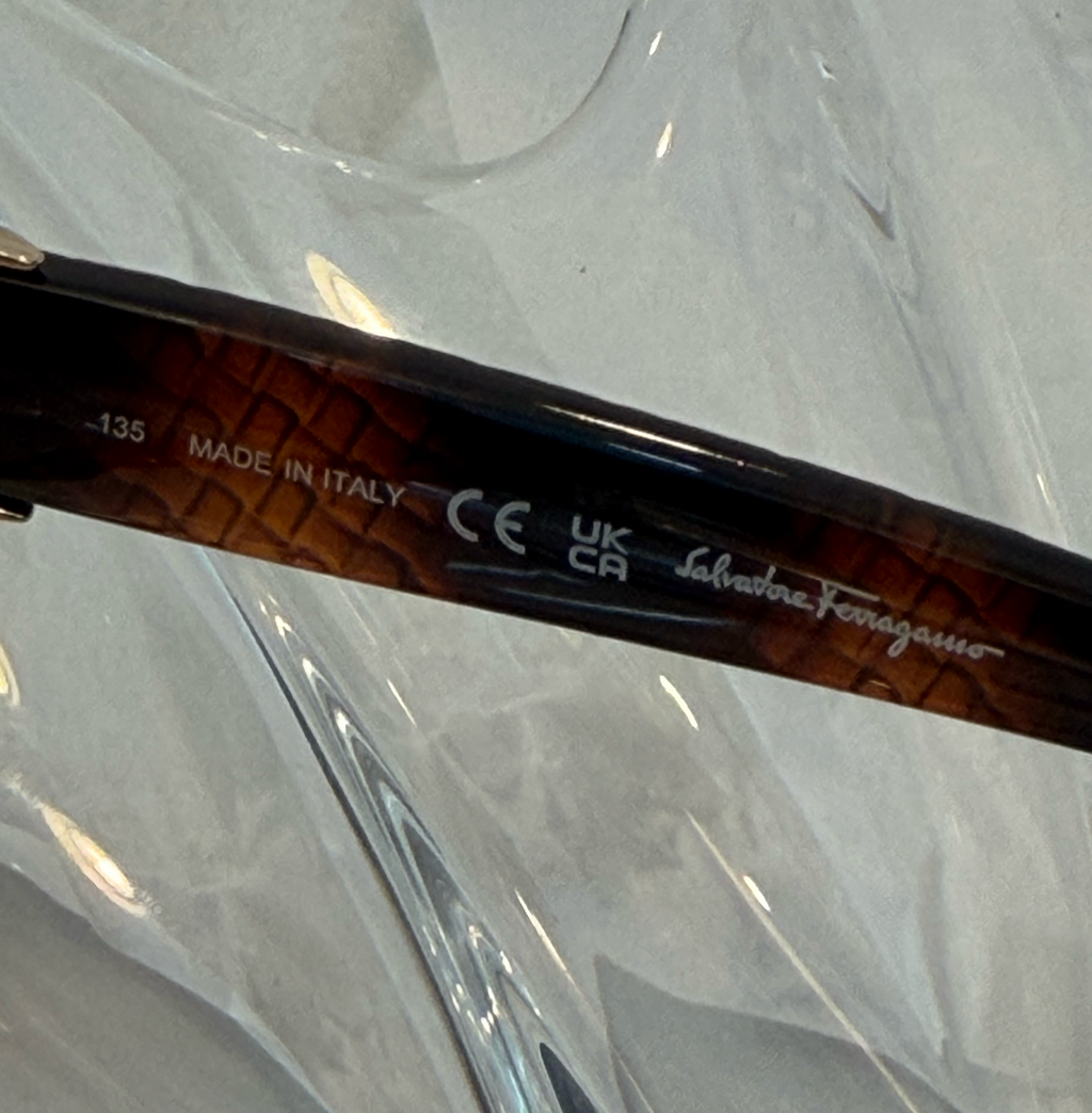 Salvatore Ferragamo oversized butterfly sunglasses back view with temples crossed on crystal display