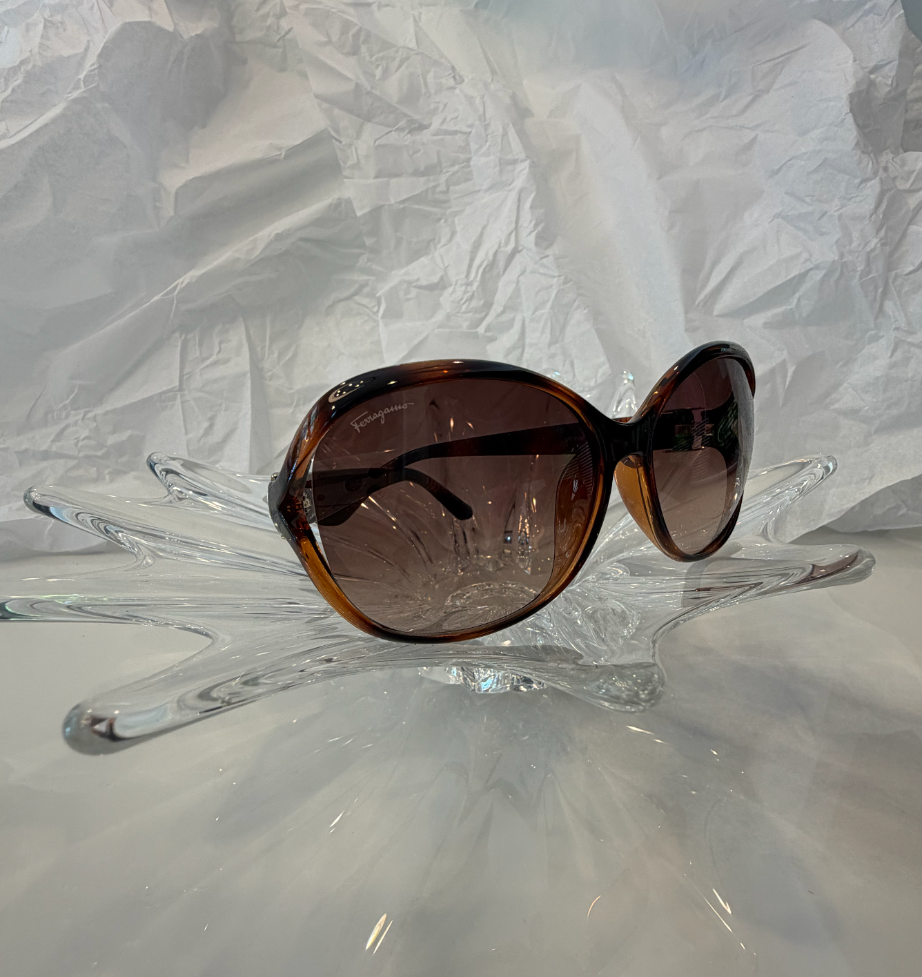 Salvatore Ferragamo quilted dark brown temple detail close-up with silver hinge plate