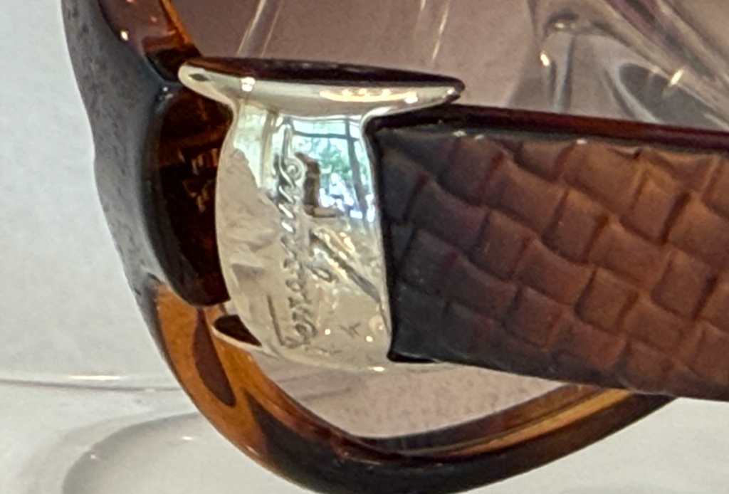 Salvatore Ferragamo oversized butterfly sunglasses back angle view on crystal display