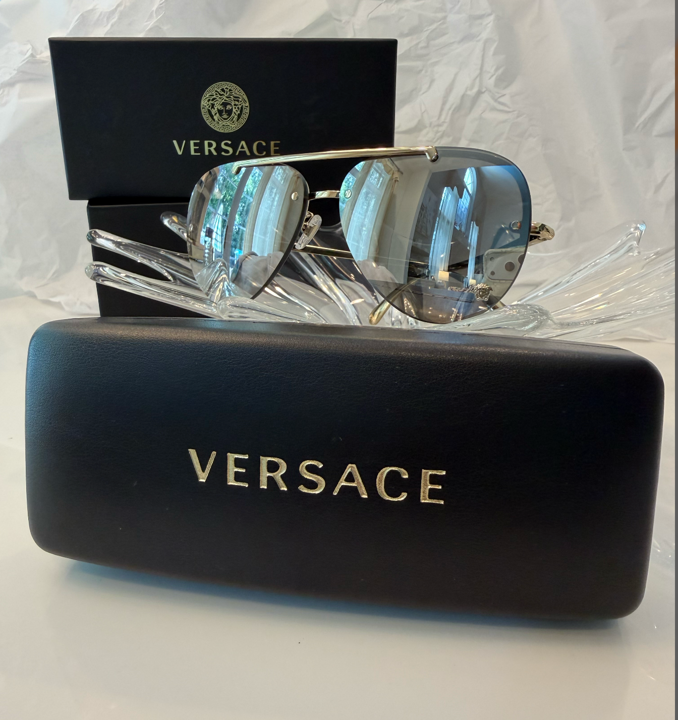 Versace MOD 2231 gold rimless aviator sunglasses front view with original Versace black box