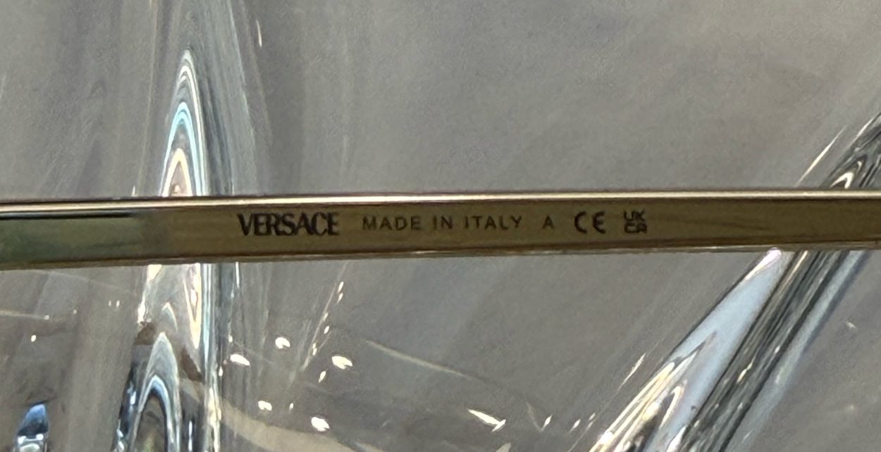 Versace MOD 2231 gold rimless aviator sunglasses additional angle view on crystal display