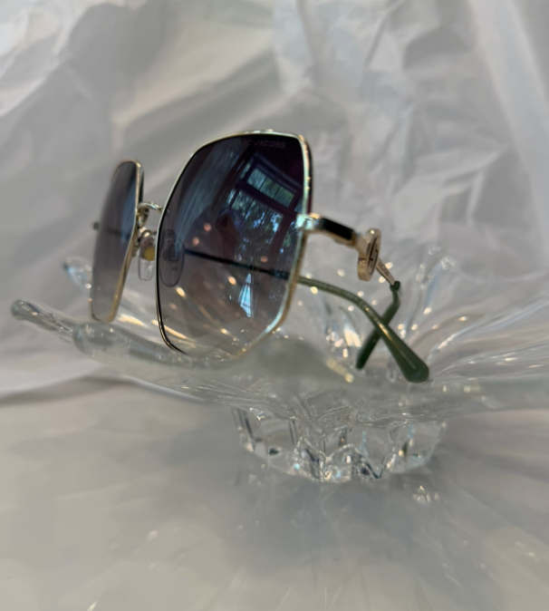 Marc Jacobs MARC 730/S gold oversized square sunglasses back view showing sage green temples on crystal display