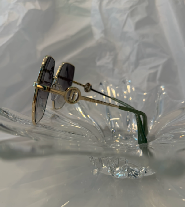 Marc Jacobs MARC 730/S gold oversized square sunglasses front view on crystal display
