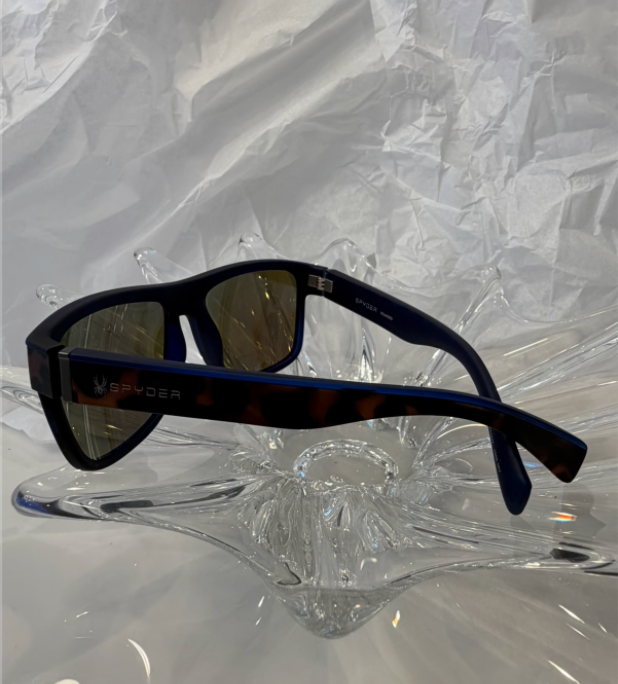 Spyder SP6014 tortoise sunglasses back view showing blue mirror lenses on crystal display