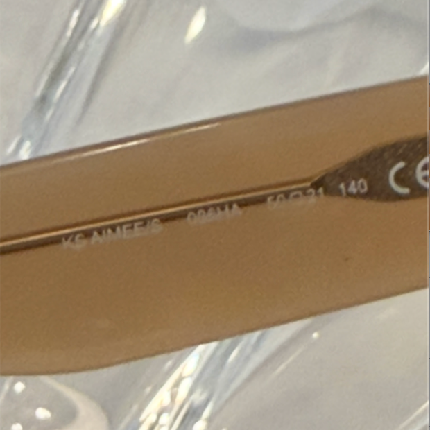 Kate Spade New York Hello Sunshine cat-eye sunglasses front view on crystal display