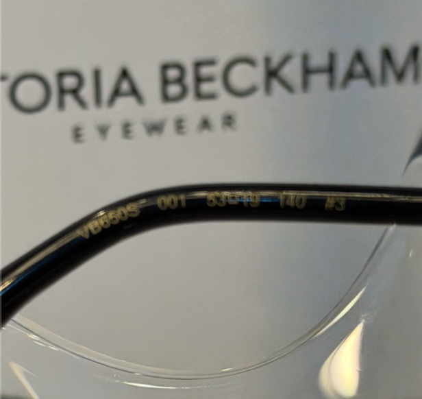 Victoria Beckham VB605S black shield sunglasses front view on crystal display