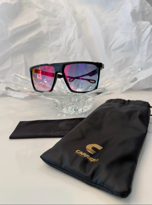 Carrera 4019/S Festival Edition black flat-top sunglasses back view with temples crossed on crystal display
