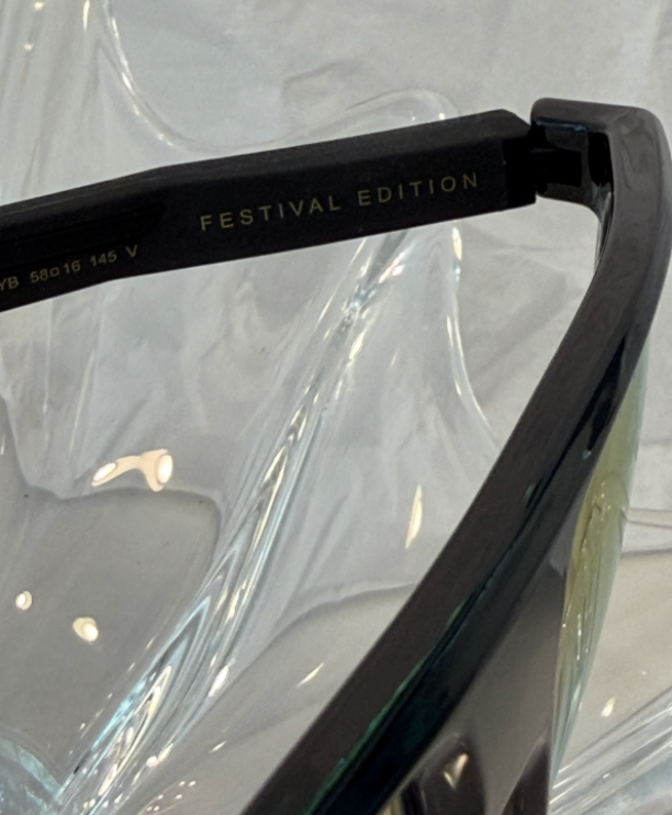 Carrera 4019/S Festival Edition black flat-top sunglasses front view showing blue gradient lenses on crystal display
