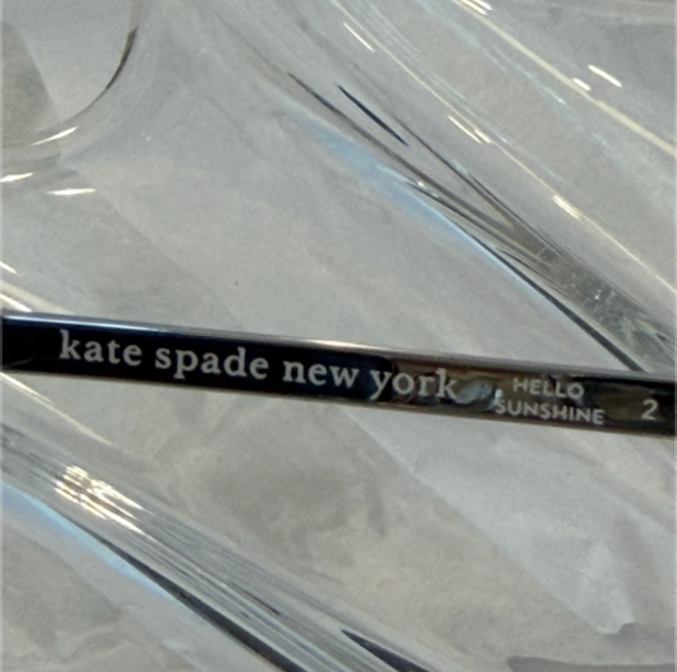 Kate Spade STACUG/S temple close-up showing kate spade new york HELLO SUNSHINE 2 inscription