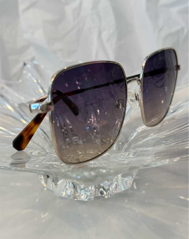 Kenneth Cole Reaction KC00025 silver oversized square sunglasses side angle view on crystal display