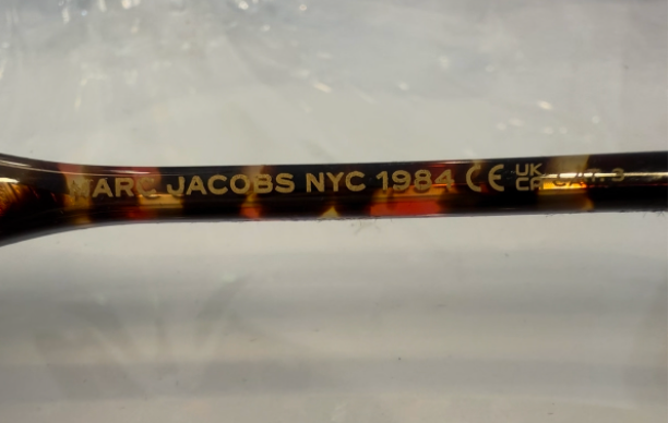 Marc Jacobs MARC 763/S temple showing MARC JACOBS NYC 1984 CE UKCA certification engraving