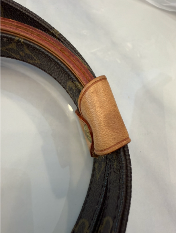 Full leash coiled on white surface