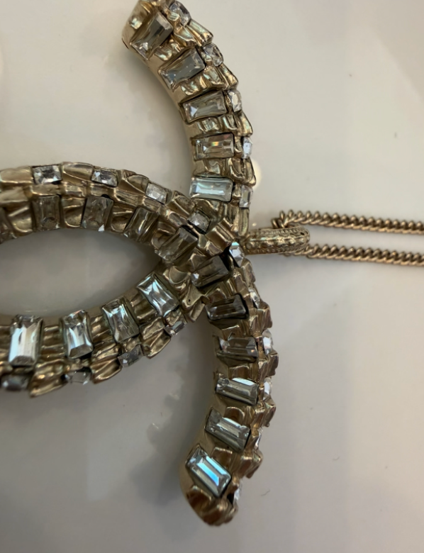 Chanel CC rhinestone top detail close-up
