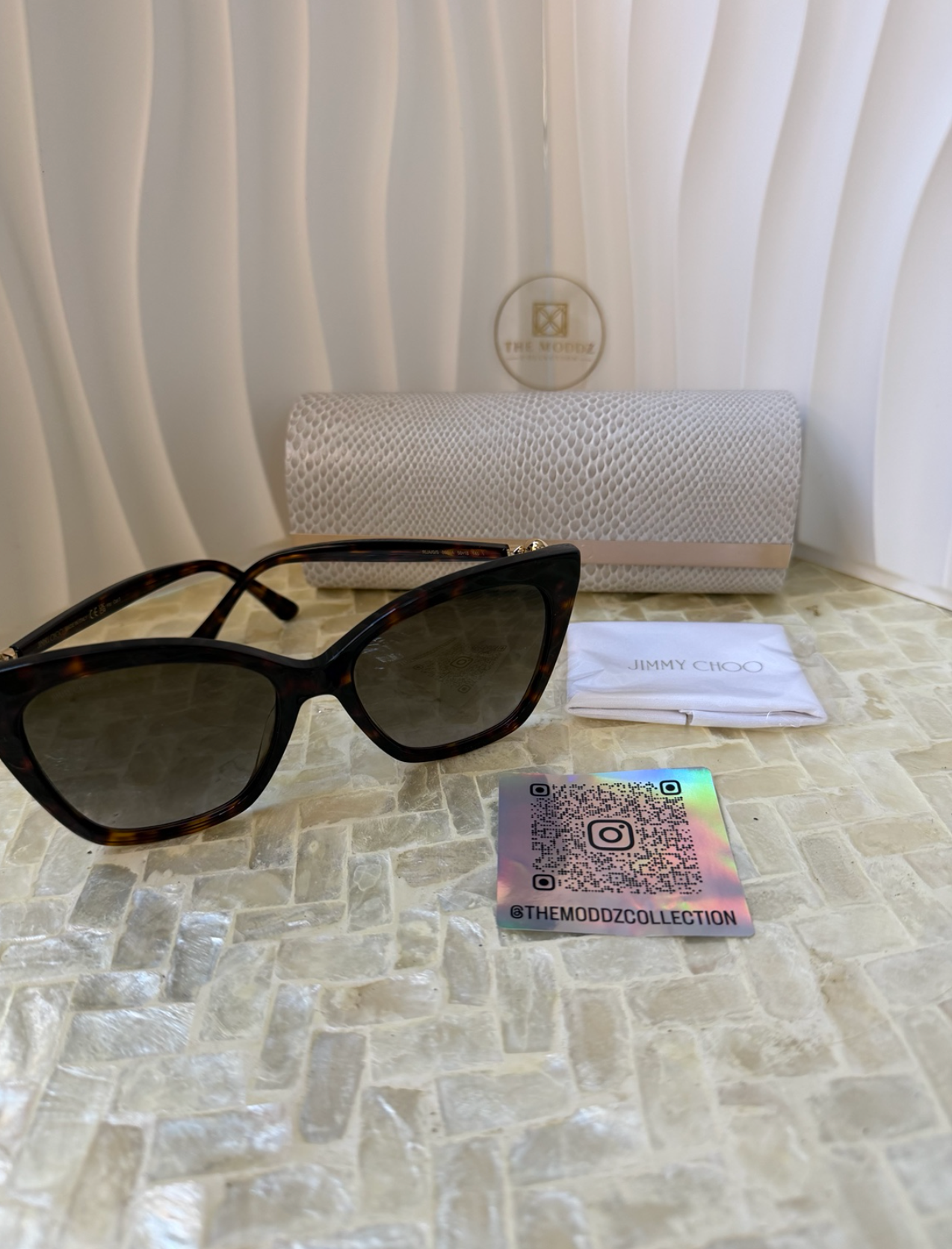 Jimmy Choo cat eye sunglasses showing pearl and rhinestone temple detail – side view