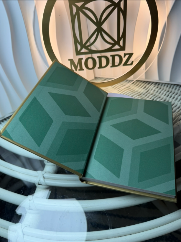 Little Book of Gucci open showing green diamond motif endpapers