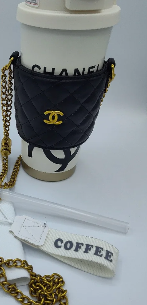 Chanel tumbler in quilted black lambskin cupholder crossbody bag with gold CC hardware and chain strap