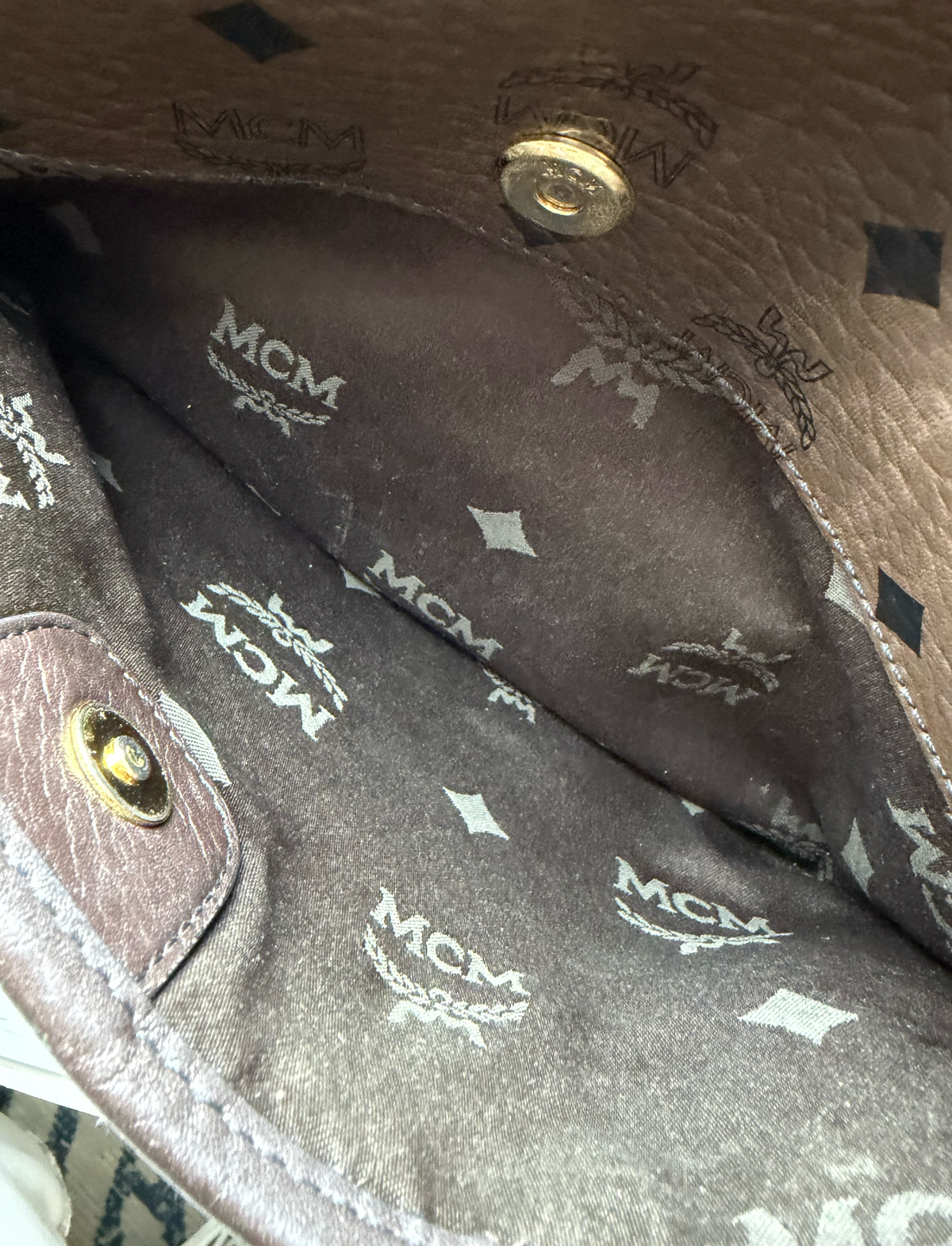 MCM bag interior detail showing MCM monogram lining