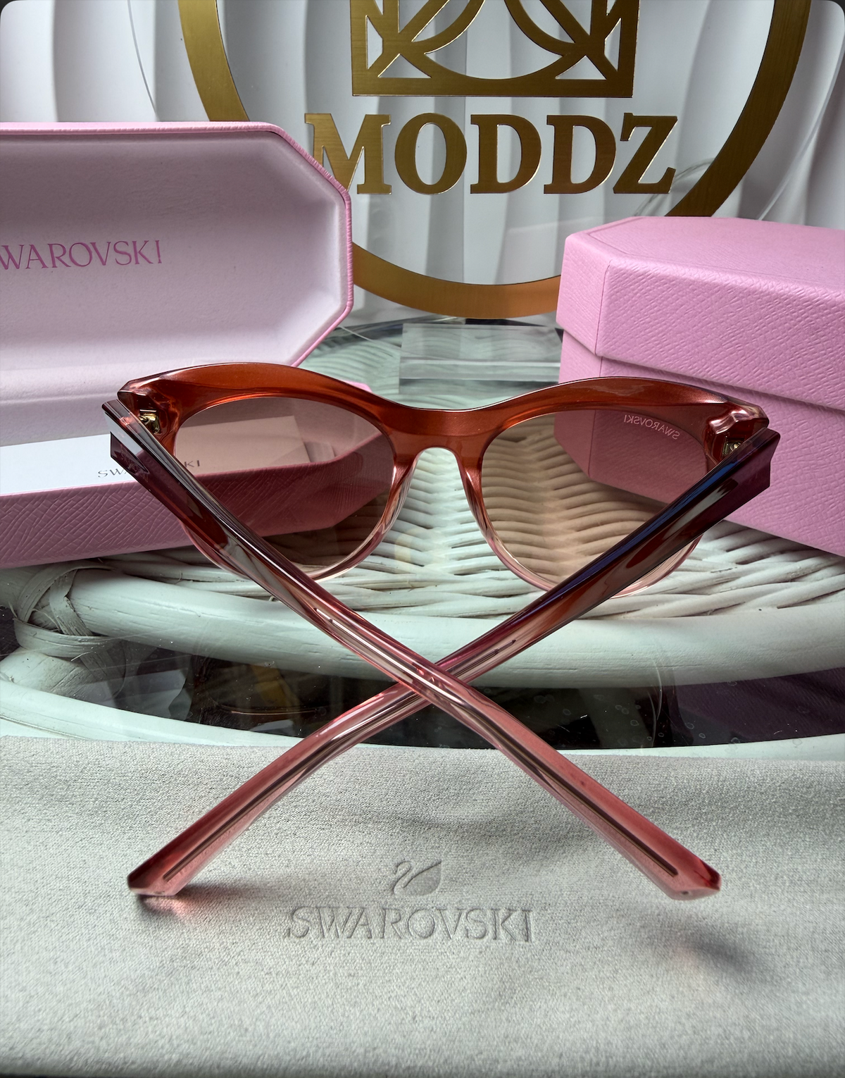Swarovski pink iridescent cat-eye sunglasses with crystals and pink hexagonal case, Swarovski cleaning cloth